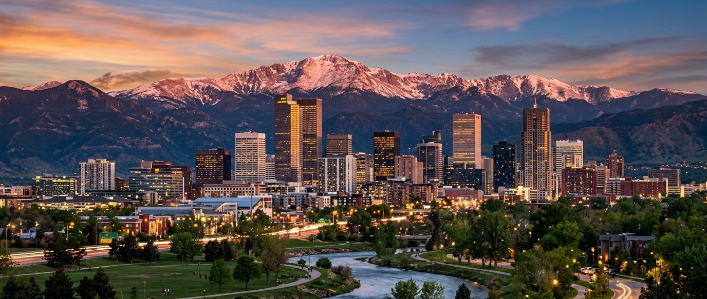 Denver skyline with Rocky Mountains at sunset, services guide hero